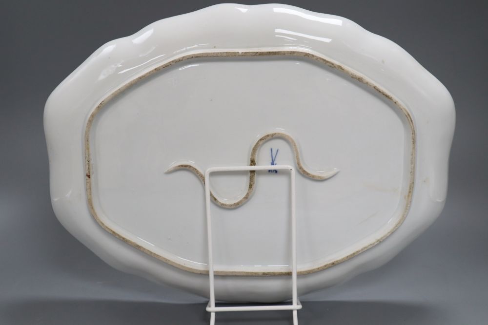 A Meissen porcelain figural painted dish, length 36cm